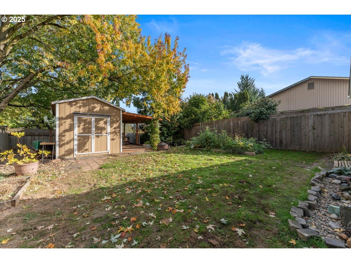 3837 North Juneau Street Portland, OR 97203 - Photo 25 of 32 a front view of a house with garden