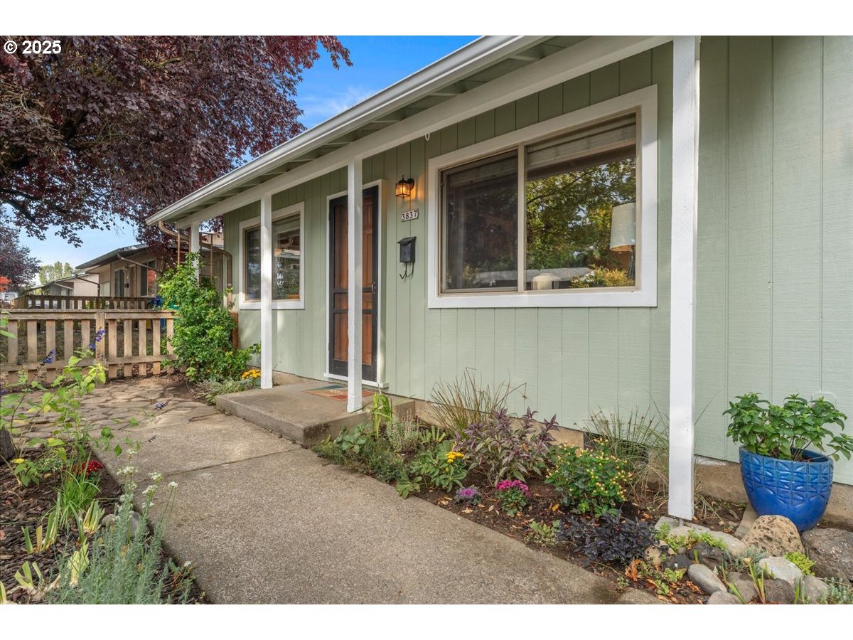 3837 North Juneau Street Portland, OR 97203 - Photo 2 of 32 a view of a house with potted plants