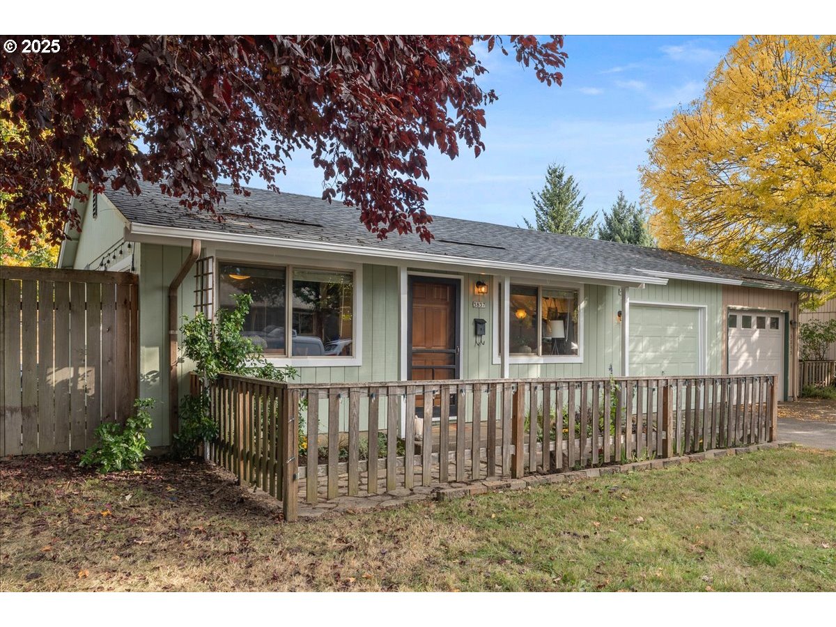 3837 North Juneau Street Portland, OR 97203 - Photo 31 of 32 a view of a house with a yard and wooden fence