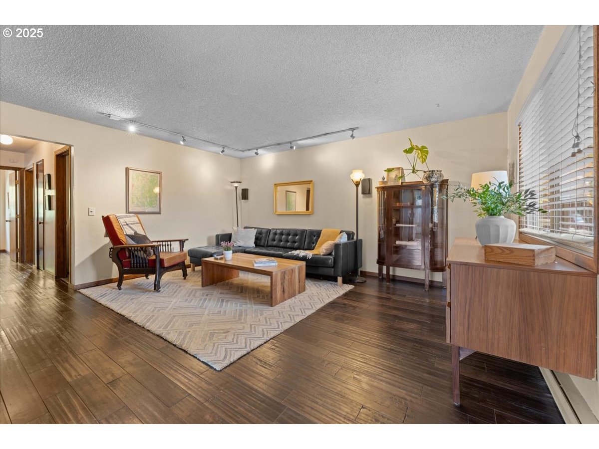 3837 North Juneau Street Portland, OR 97203 - Photo 3 of 32 a living room with furniture and wooden floor
