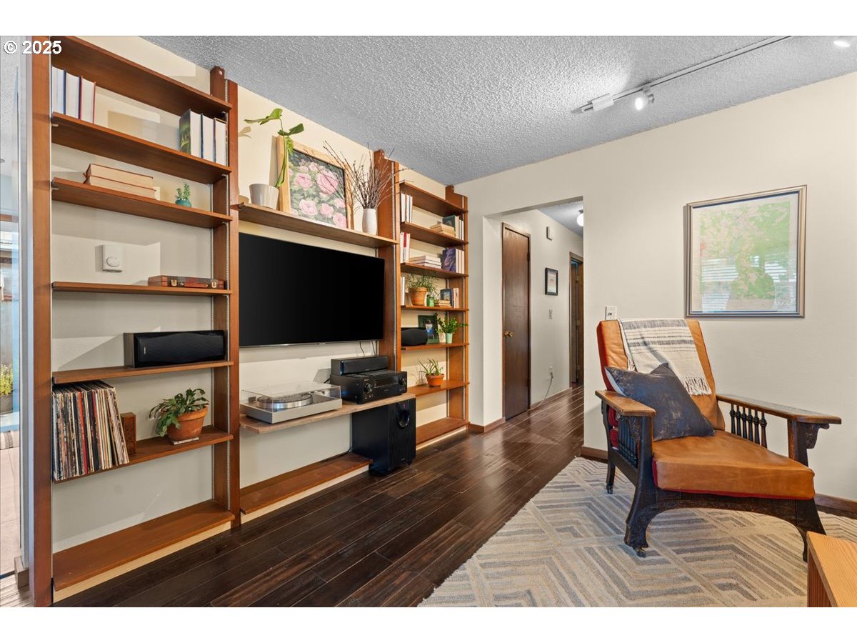 3837 North Juneau Street Portland, OR 97203 - Photo 4 of 32 a living room with furniture and a flat screen tv