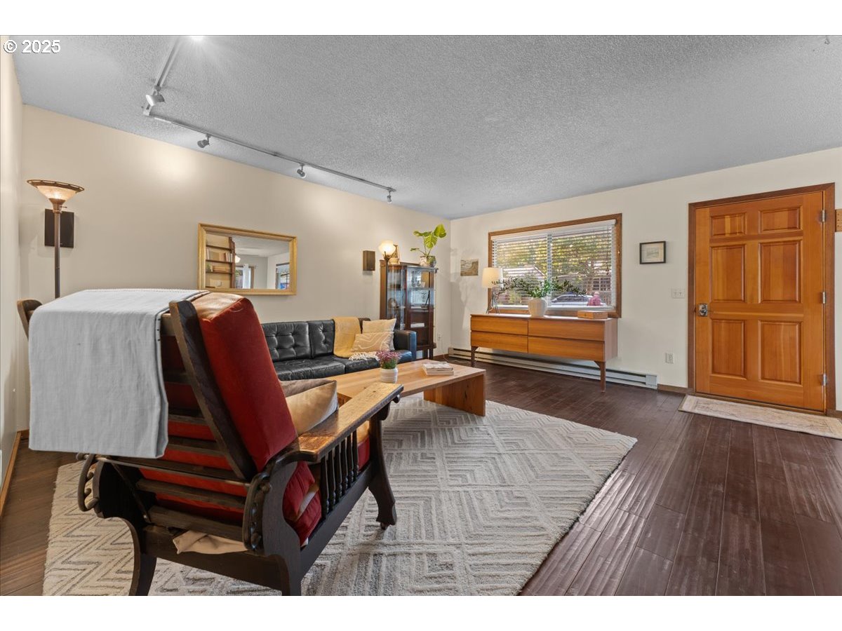 3837 North Juneau Street Portland, OR 97203 - Photo 5 of 32 a living room with furniture and wooden floor