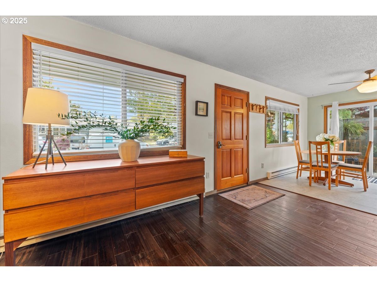 3837 North Juneau Street Portland, OR 97203 - Photo 6 of 32 a living room with furniture and large windows