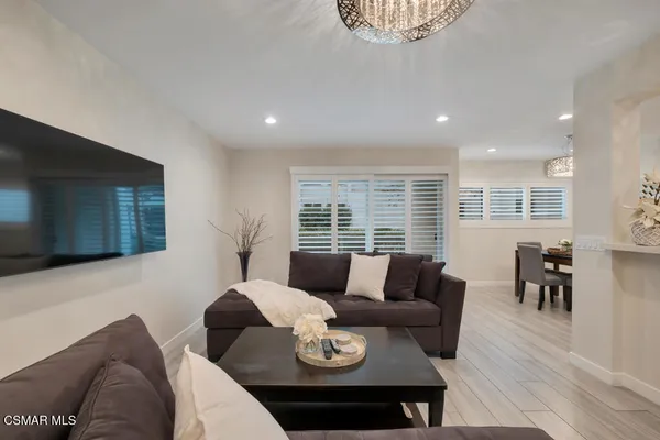 a living room with furniture and a table