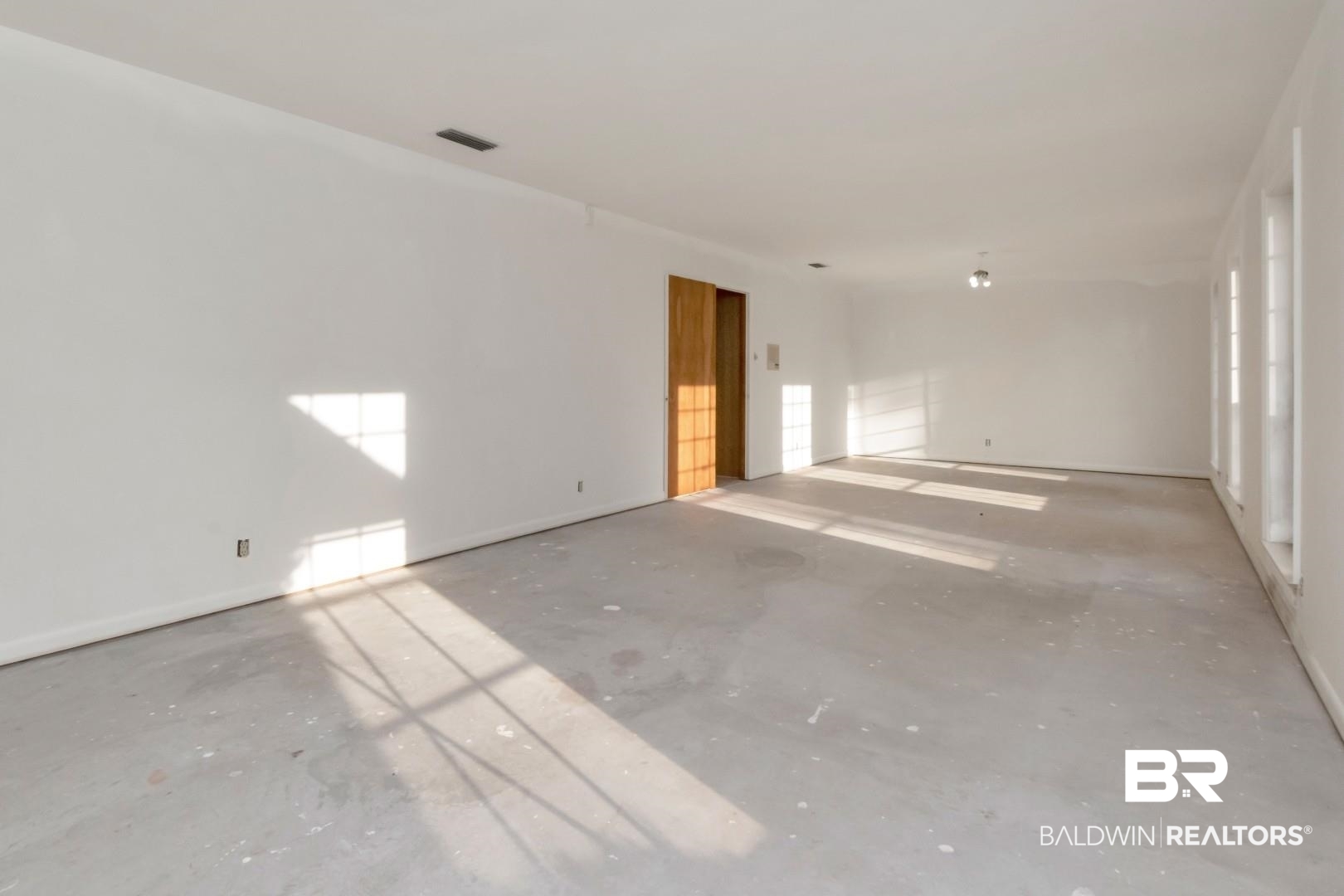 241 Suzanne Circle Mobile, AL 36608 - Photo 15 of 41 Empty room featuring unfinished concrete floors