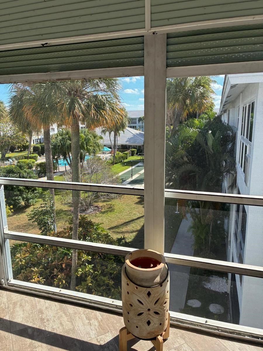 2050 Northeast 39th Street, Unit 311 Lighthouse Point, FL 33064 - Photo 16 of 17 a view of a chair and table in the balcony