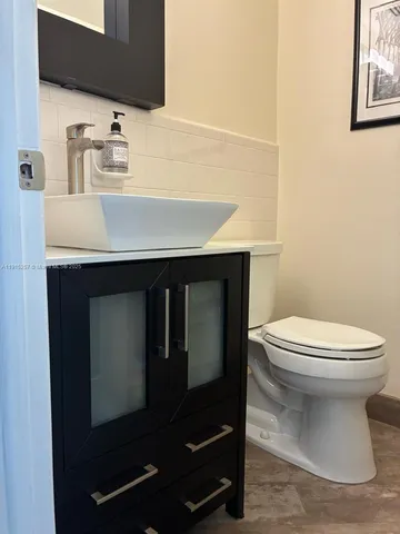 a bedroom with a bed and dresser