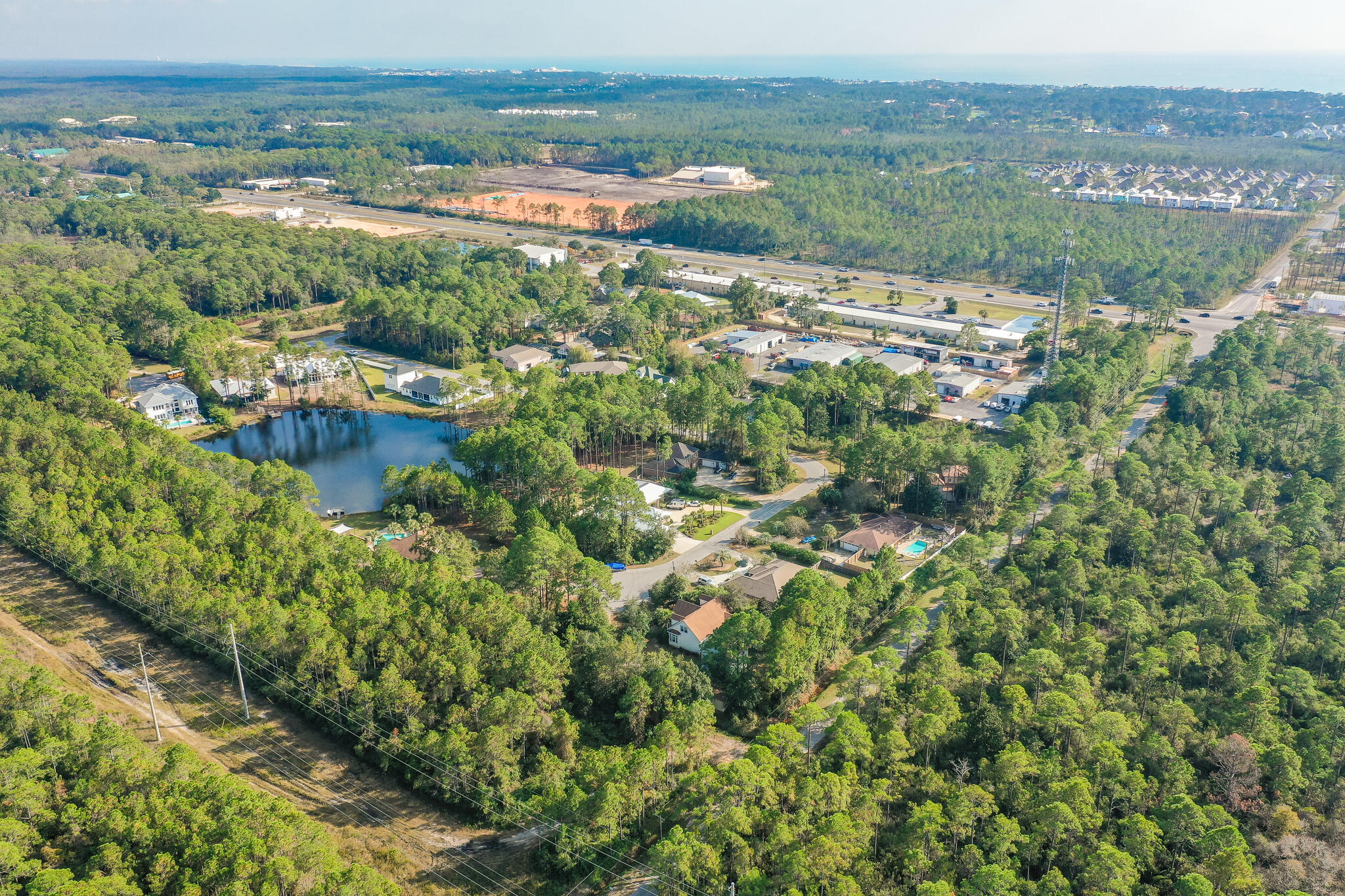 Lot 8 Bishop-Tolbert Road Santa Rosa Beach, FL 32459 - Photo 5 of 9 an aerial view of residential houses with outdoor space and trees