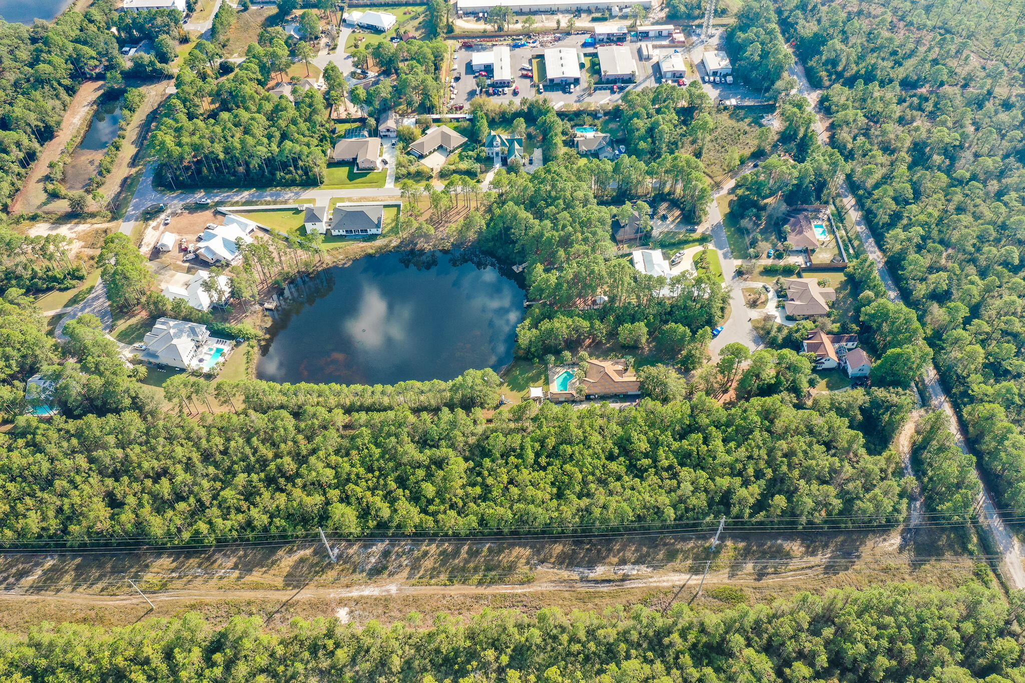 Lot 8 Bishop-Tolbert Road Santa Rosa Beach, FL 32459 - Photo 9 of 9 a view of a garden with a bench