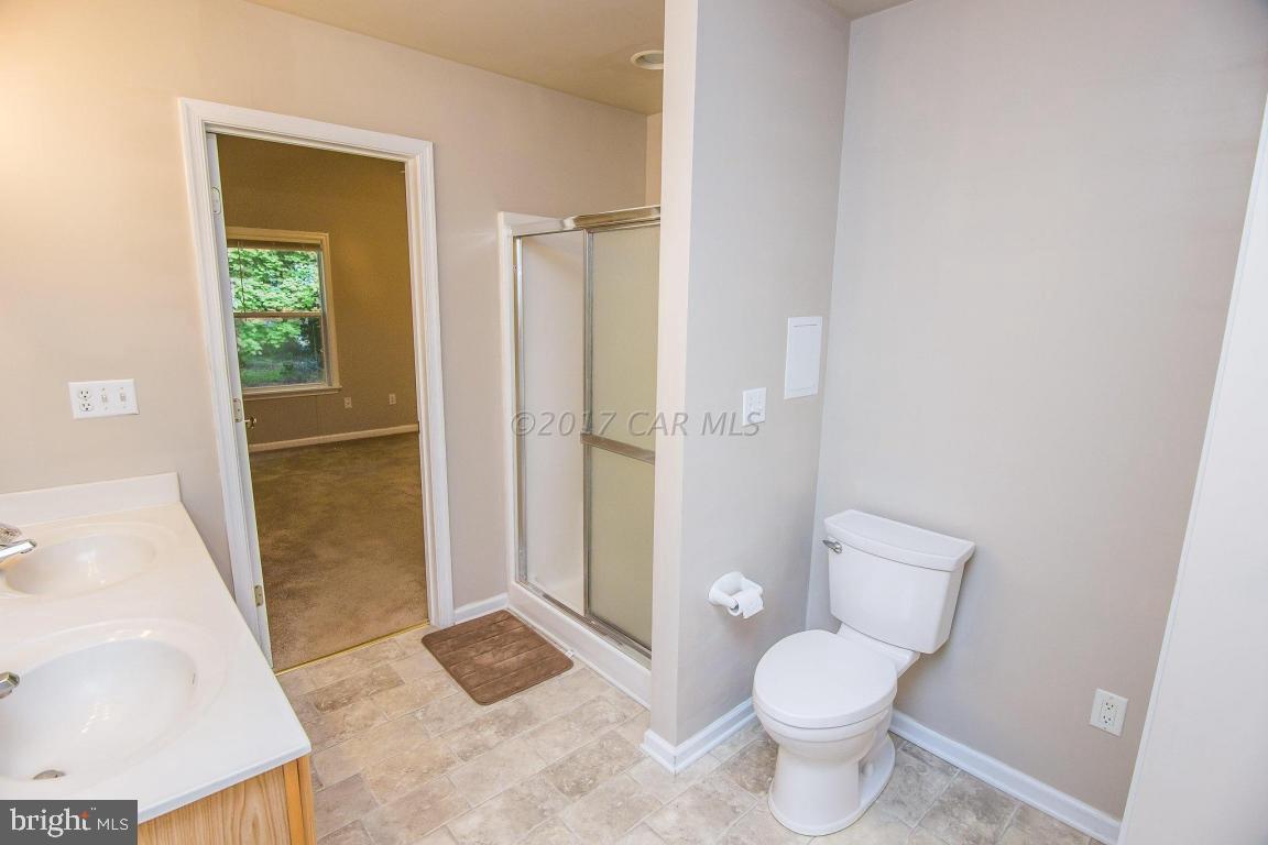 49 Beaconhill Road Ocean Pines, MD 21811 - Photo 13 of 62 a bathroom with a toilet and a shower