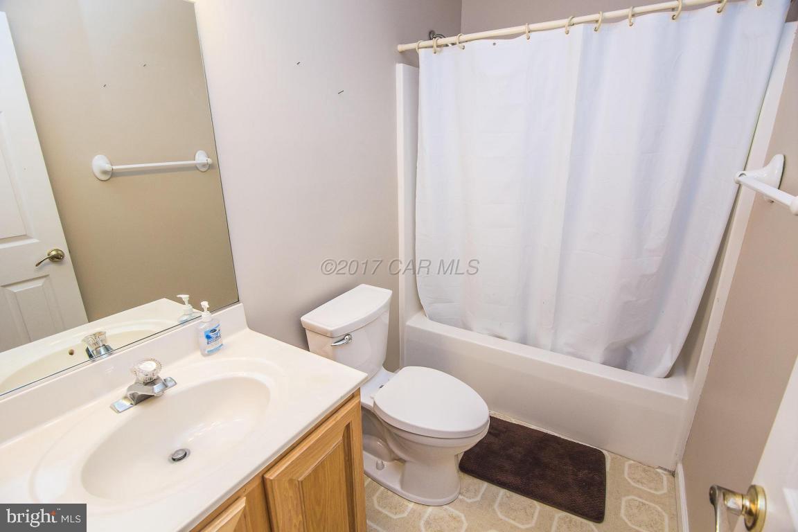 49 Beaconhill Road Ocean Pines, MD 21811 - Photo 19 of 62 a bathroom with a sink toilet and shower