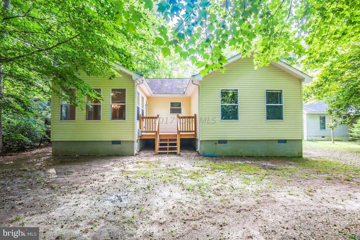 49 Beaconhill Road Ocean Pines, MD 21811 - Photo 22 of 62 a view of a house with a backyard