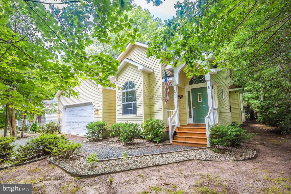 49 Beaconhill Road Ocean Pines, MD 21811 - Photo 24 of 62 a view of a house with a yard and plants
