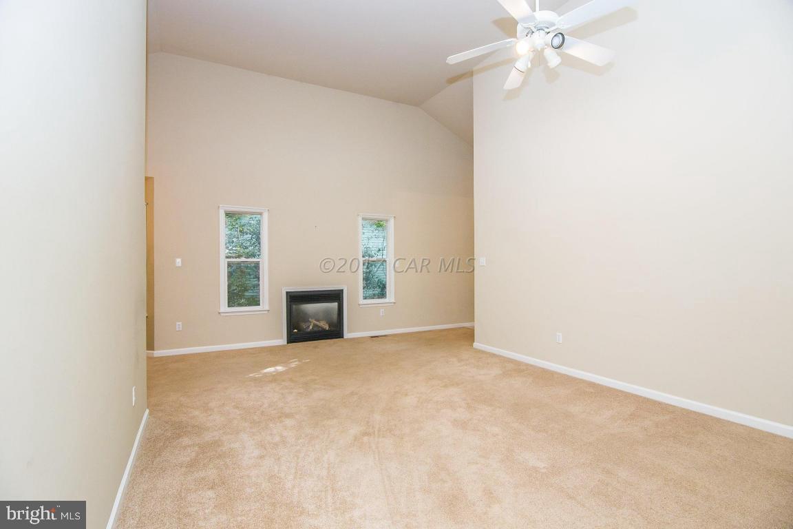 49 Beaconhill Road Ocean Pines, MD 21811 - Photo 26 of 62 an empty room with windows and fireplace