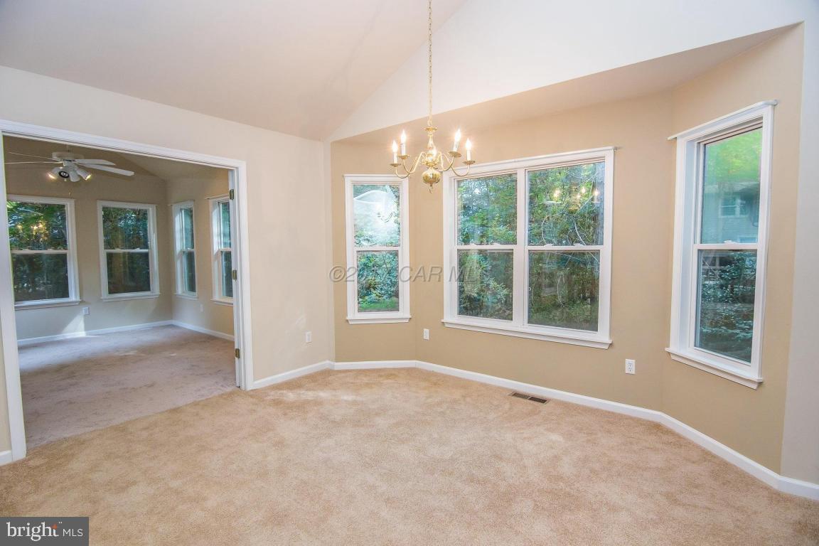 49 Beaconhill Road Ocean Pines, MD 21811 - Photo 30 of 62 a view of an empty room with a window