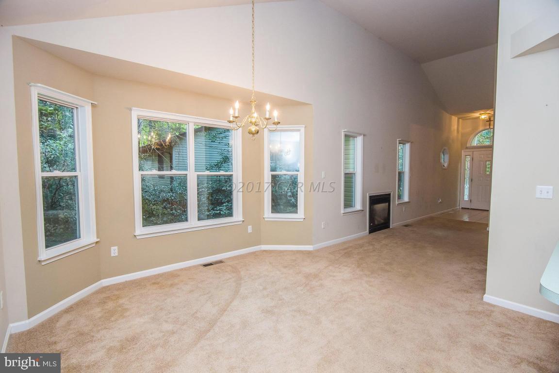 49 Beaconhill Road Ocean Pines, MD 21811 - Photo 4 of 62 a view of an empty room with a window