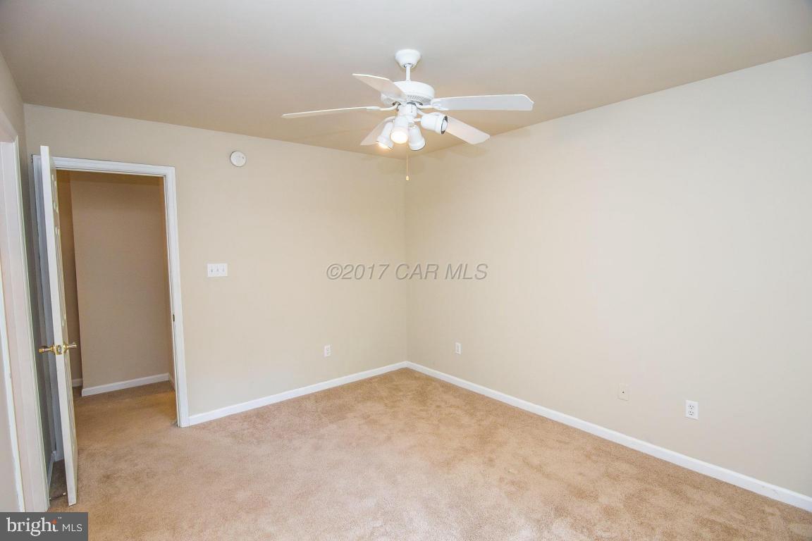 49 Beaconhill Road Ocean Pines, MD 21811 - Photo 38 of 62 an empty room with a fan and a fan