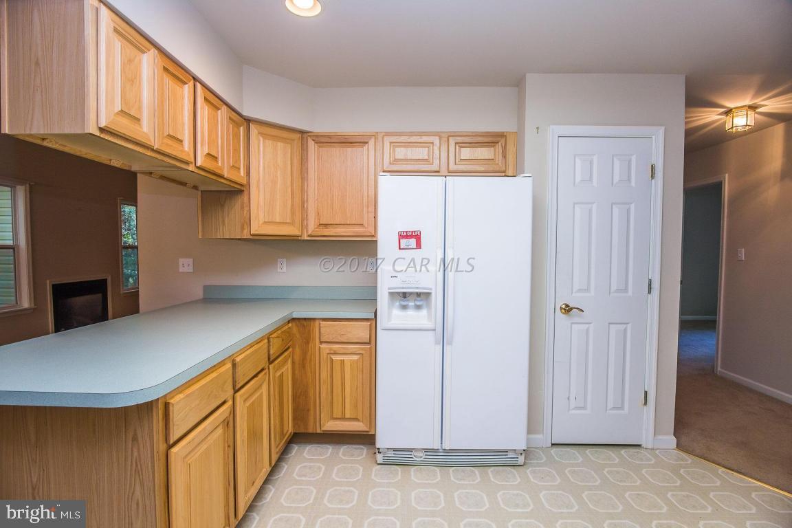 49 Beaconhill Road Ocean Pines, MD 21811 - Photo 7 of 62 a kitchen with stainless steel appliances granite countertop a refrigerator and a sink