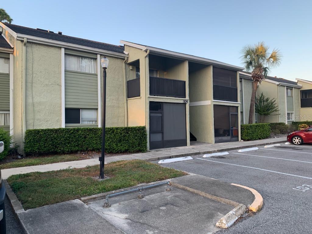 924 Lake Destiny Road, Unit 924B Altamonte Springs, FL 32714 - Photo 1 of 1 a front view of a house with a yard and garage