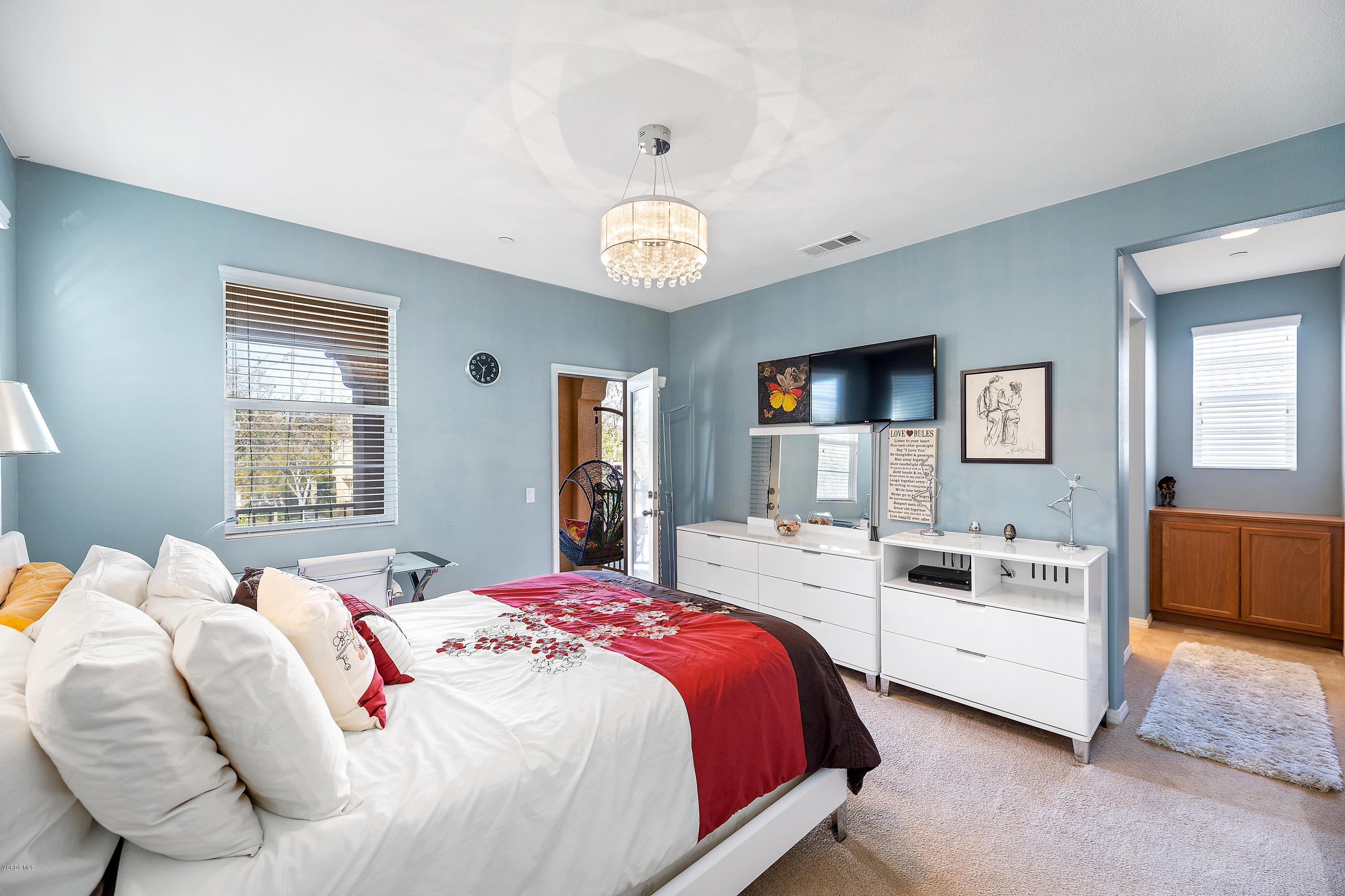 3144 North Ventura Road Oxnard, CA 93036 - Photo 5 of 18 a spacious bedroom with a bed and a flat screen tv