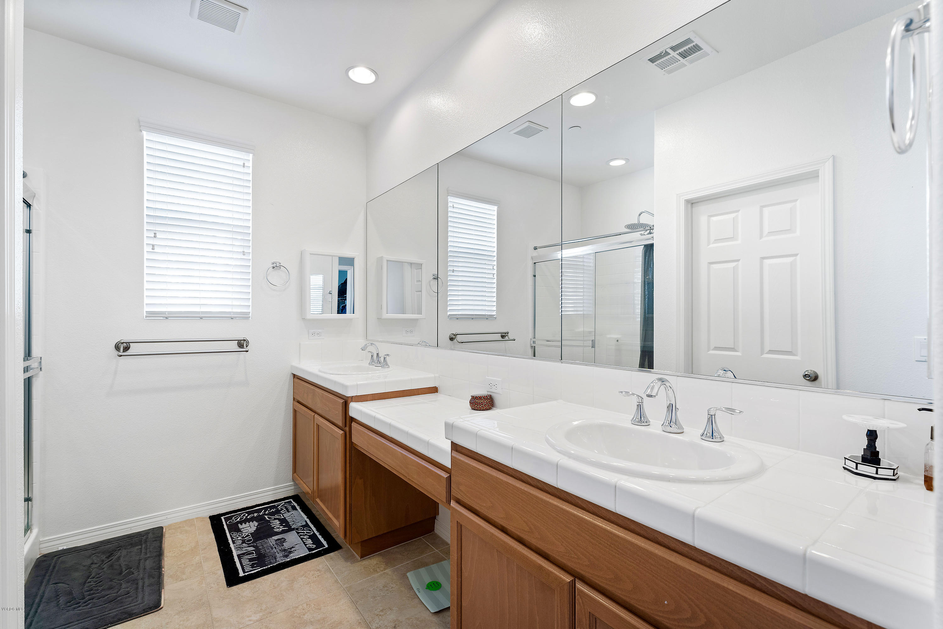 3144 North Ventura Road Oxnard, CA 93036 - Photo 6 of 18 a bathroom with a sink double vanity and a mirror