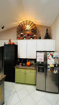 a kitchen with a cabinets and window