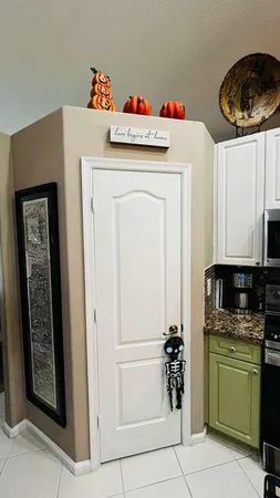 a white refrigerator freezer and a stove sitting inside of a kitchen