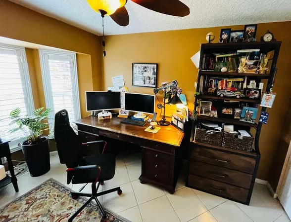 a view of a workspace with furniture