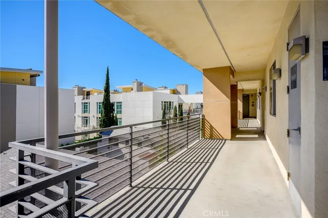 a view of a balcony with car parked