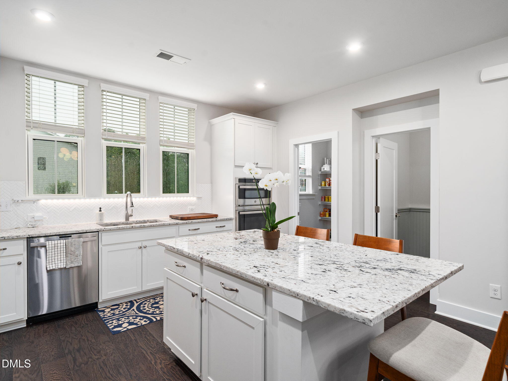 916 Waterside View Drive Raleigh, NC 27606 - Photo 9 of 22 a kitchen with center island table and chairs
