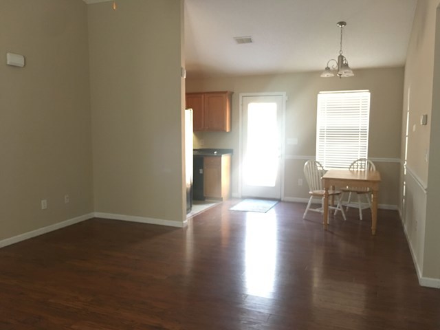 260 Autumn Ridge Court Gray, GA 31032 - Photo 14 of 28 a view of empty room with wooden floor and fan