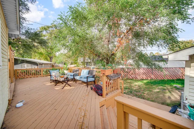 a view of a backyard with sitting area