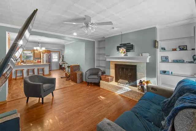 a living room with furniture and a fireplace