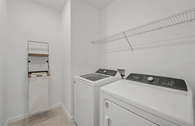 a utility room with dryer and washer