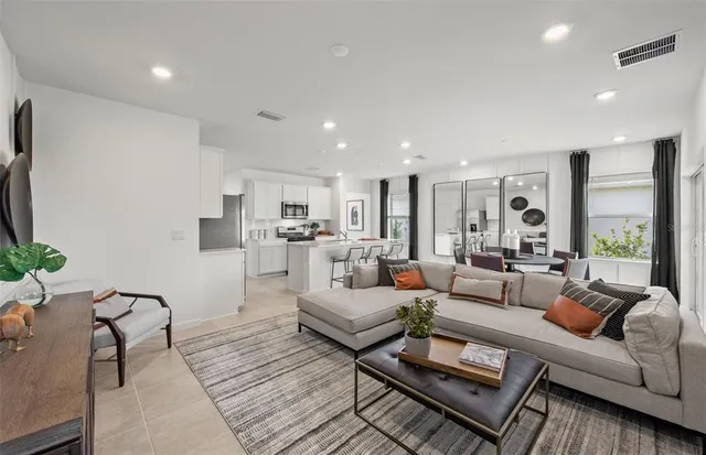 a living room with furniture and a large window