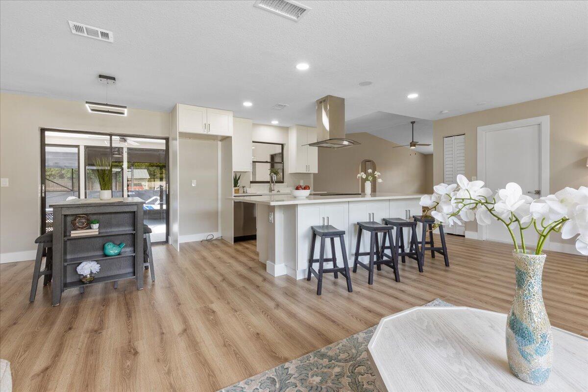 2138 Southeast Dolphin Road Port St. Lucie, FL 34952 - Photo 12 of 31 a living room with furniture and a table