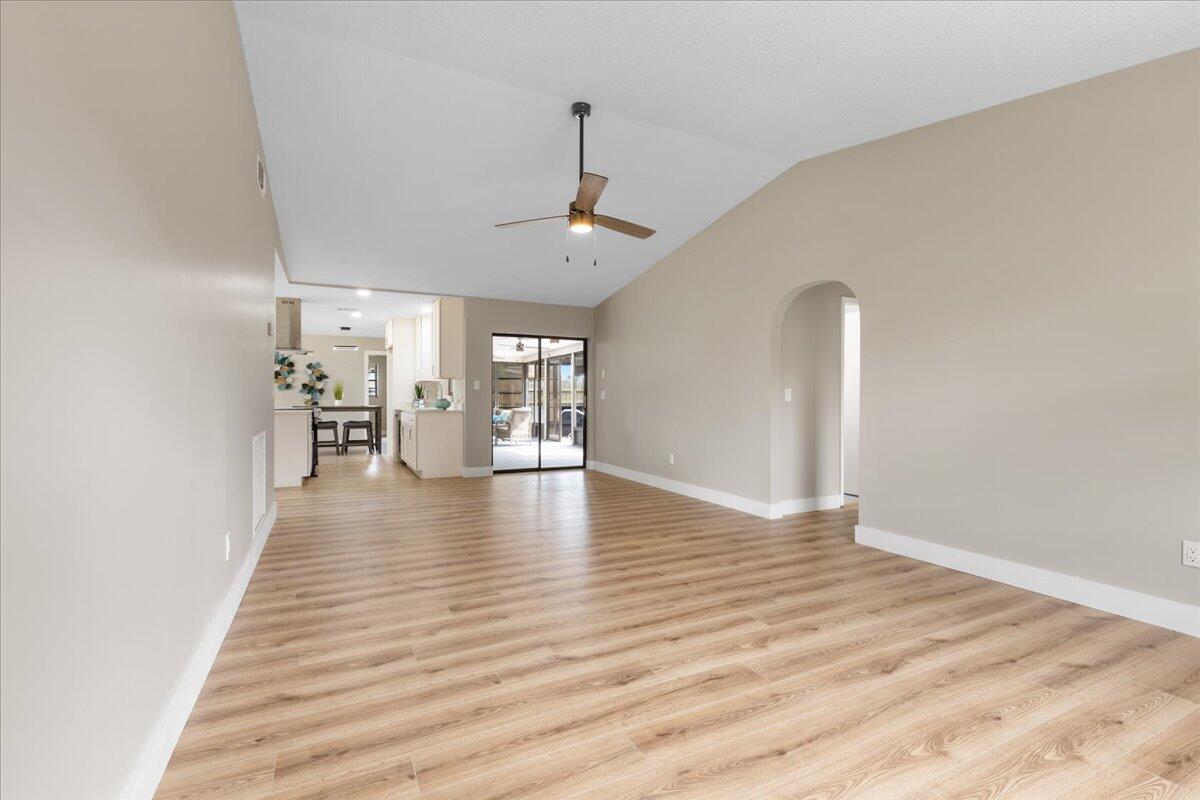 2138 Southeast Dolphin Road Port St. Lucie, FL 34952 - Photo 14 of 31 a view of a livingroom with wooden floor