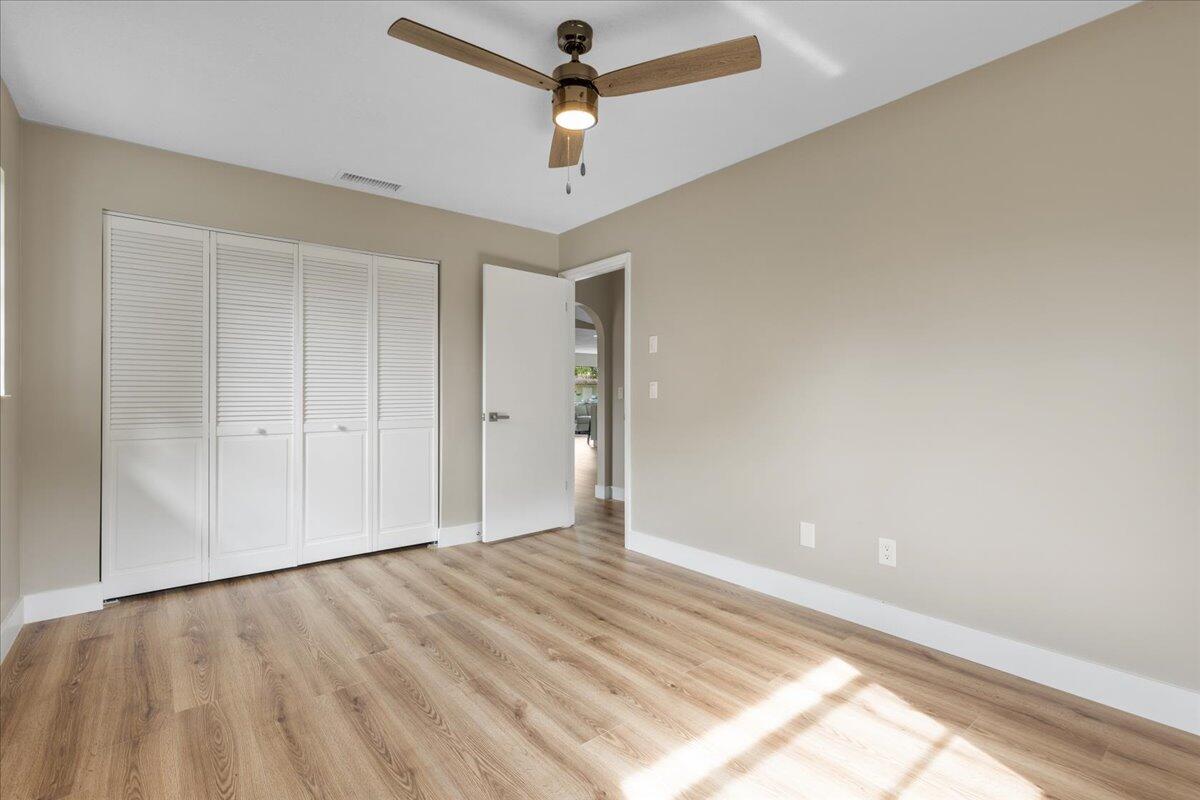 2138 Southeast Dolphin Road Port St. Lucie, FL 34952 - Photo 20 of 31 wooden floor in an empty room
