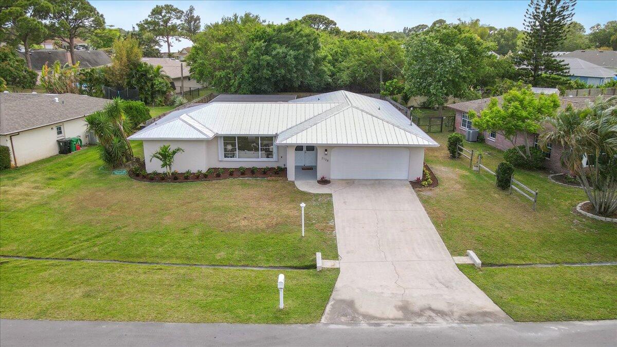 2138 Southeast Dolphin Road Port St. Lucie, FL 34952 - Photo 25 of 31 a aerial view of a house