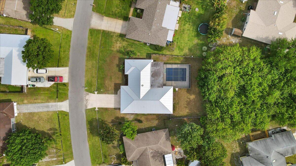 2138 Southeast Dolphin Road Port St. Lucie, FL 34952 - Photo 28 of 31 an aerial view of a house with a yard basket ball court and outdoor seating