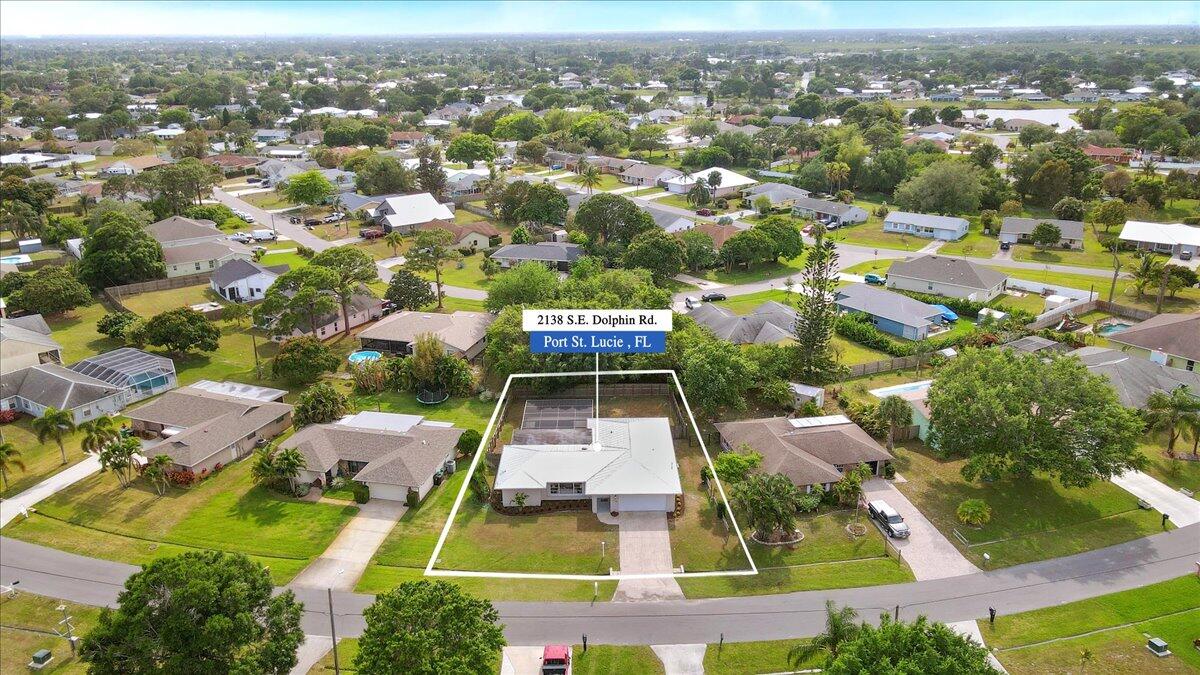 2138 Southeast Dolphin Road Port St. Lucie, FL 34952 - Photo 3 of 31 an aerial view of residential houses with outdoor space