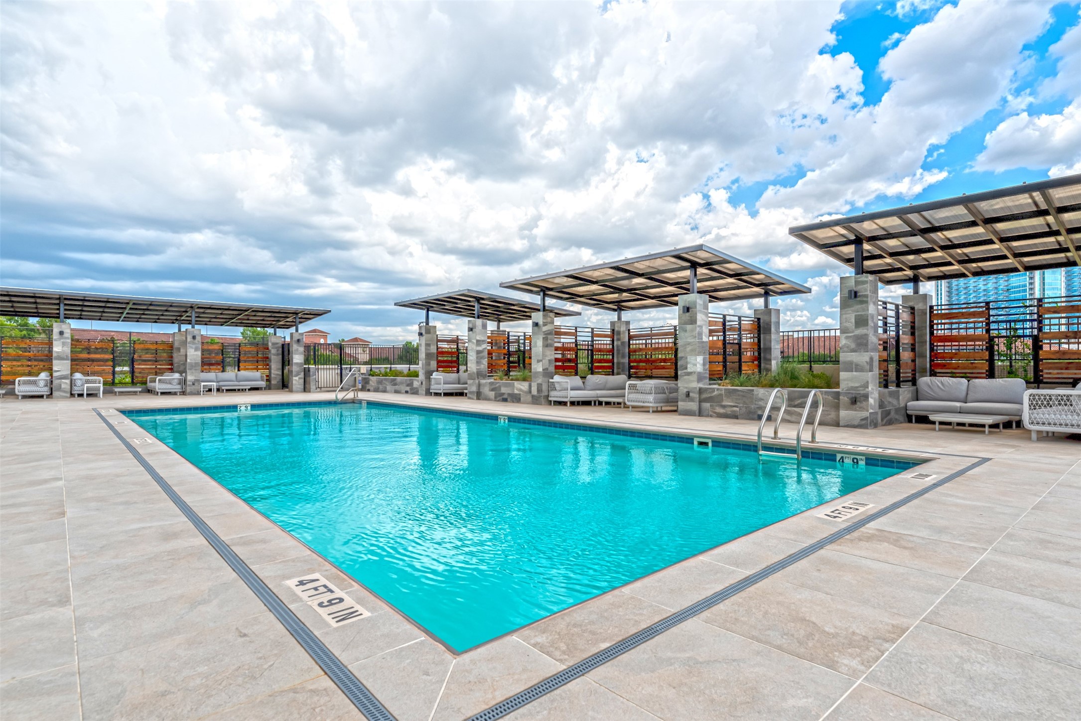 1701 Hermann Drive, Unit 34L Houston, TX 77004 - Photo 27 of 37 Private cabanas flank poolside and are a perfect place to relax and enjoy an afternoon.