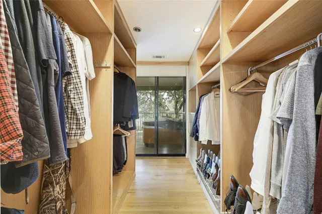 a view of walk in entryway with furniture and shower
