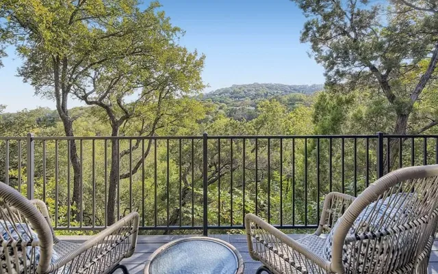 a view of a balcony with furniture