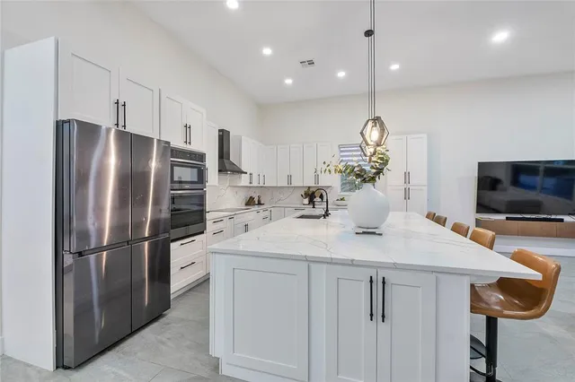 a spacious bathroom with a granite countertop tub sink and shower