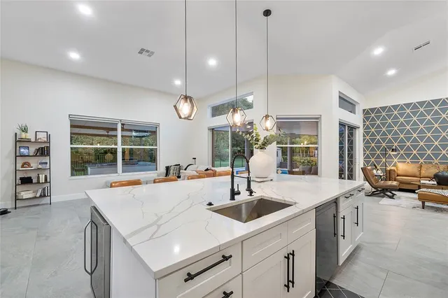 a living room with furniture a window and gym equipment