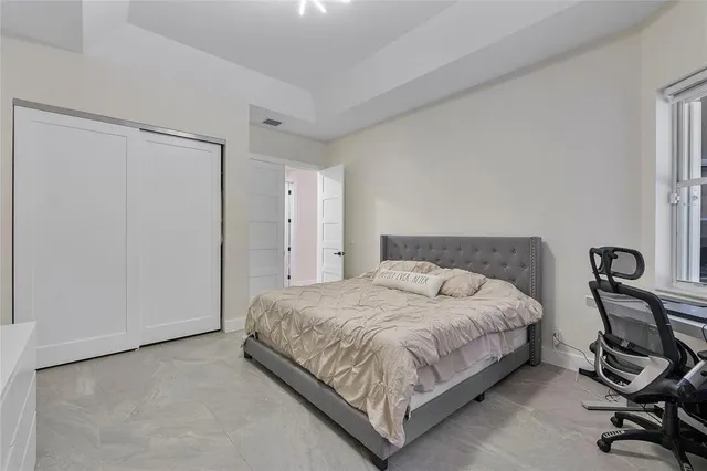 a view of a patio with a table and chairs