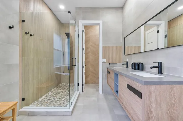 a kitchen with a table chairs and wooden floor
