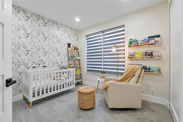 a dining room with stainless steel appliances granite countertop a table and chairs with wooden floor