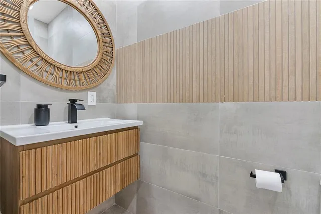 a view of a house with pool and chairs